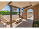 Inviting front porch with brick accents, a concrete bench, and lush landscaping at 4944 W Vista Ave, Glendale, AZ 85301