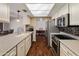 Modern kitchen equipped with stainless steel appliances, sleek countertops, and ample cabinet space at 4944 W Vista Ave, Glendale, AZ 85301
