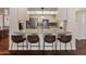 Stylish kitchen featuring a breakfast bar, stainless steel appliances, and modern finishes at 4944 W Vista Ave, Glendale, AZ 85301