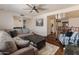 Spacious living room showcasing hardwood floors, a gray sofa, and an open layout at 4944 W Vista Ave, Glendale, AZ 85301