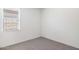 Cozy bedroom showcases neutral carpet and a window providing natural light at 5012 S 106Th Ln, Tolleson, AZ 85353