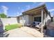 Cozy covered patio area with stylish outdoor furniture and a small patch of artificial grass at 609 E Royal Palm S Sq, Phoenix, AZ 85020