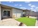 Charming backyard featuring artificial grass, a paved patio, and a covered seating area at 609 E Royal Palm S Sq, Phoenix, AZ 85020