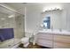 Modern bathroom featuring a glass-enclosed shower, sleek vanity, and contemporary fixtures at 609 E Royal Palm S Sq, Phoenix, AZ 85020