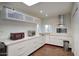 Bright kitchen featuring white cabinets, granite countertops, stainless steel appliances, and ample storage at 609 E Royal Palm S Sq, Phoenix, AZ 85020