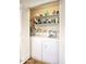 Functional laundry room with washer, dryer, and shelving for storage, inside of the home at 609 E Royal Palm S Sq, Phoenix, AZ 85020