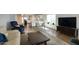 Bright, open-concept living room with a view into the modern kitchen at 609 E Royal Palm S Sq, Phoenix, AZ 85020