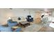 Open-concept living room with dining area and modern decor, bathed in natural light at 609 E Royal Palm S Sq, Phoenix, AZ 85020