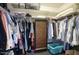Spacious walk-in closet featuring plenty of hanging space, shelving, and storage for an organized wardrobe at 609 E Royal Palm S Sq, Phoenix, AZ 85020