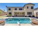 Exterior view of home with pool and water feature; perfect for outdoor enjoyment at 614 E Benrich Dr, Gilbert, AZ 85295