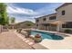 View of the home's backyard and in-ground swimming pool at 614 E Benrich Dr, Gilbert, AZ 85295