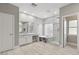 Luxurious bathroom featuring a vanity, glass shower, and tub at 614 E Benrich Dr, Gilbert, AZ 85295