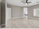 Large bedroom featuring a view of the luxurious bathroom and a modern ceiling fan at 614 E Benrich Dr, Gilbert, AZ 85295