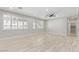 Bright bedroom featuring tile floors, a ceiling fan, and large windows with shutter blinds at 614 E Benrich Dr, Gilbert, AZ 85295