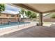 View of in-ground swimming pool from the home's covered patio at 614 E Benrich Dr, Gilbert, AZ 85295