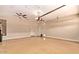 Spacious three car garage with epoxy flooring and dual ceiling fans at 614 E Benrich Dr, Gilbert, AZ 85295