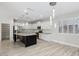 Bright kitchen featuring stainless steel appliances, granite countertops, and large center island at 614 E Benrich Dr, Gilbert, AZ 85295