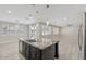 Kitchen island featuring granite countertops and stainless sink with access to backyard and living area at 614 E Benrich Dr, Gilbert, AZ 85295