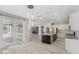 Open kitchen and living space featuring a large island, stainless appliances, and access to outdoor living at 614 E Benrich Dr, Gilbert, AZ 85295