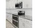 Close up of kitchen featuring stainless steel appliances, granite countertops, and white subway tile backsplash at 614 E Benrich Dr, Gilbert, AZ 85295