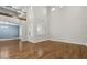 Open-concept living room featuring hardwood floors, high ceilings, modern lighting, and large windows at 614 E Benrich Dr, Gilbert, AZ 85295