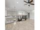 Open loft area with decorative iron railing and modern light fixtures at 614 E Benrich Dr, Gilbert, AZ 85295