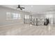 Spacious loft area featuring wood floors, decorative railings, and an abundance of natural light at 614 E Benrich Dr, Gilbert, AZ 85295