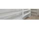 Open shelving unit with solid shelves and hardwood floors, providing ample storage and modern design at 614 E Benrich Dr, Gilbert, AZ 85295