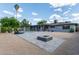 Charming backyard featuring a refreshing pool, fire pit, and lounge chairs, perfect for outdoor relaxation and entertaining at 6810 E Almeria Rd, Scottsdale, AZ 85257