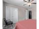 This bedroom includes a ceiling fan and a spacious closet at 6810 E Almeria Rd, Scottsdale, AZ 85257