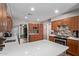 Spacious kitchen featuring stainless appliances, stone backsplash, and quartz countertops at 6810 E Almeria Rd, Scottsdale, AZ 85257