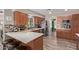 Well-equipped kitchen with stainless appliances, island seating, and lots of storage at 6810 E Almeria Rd, Scottsdale, AZ 85257