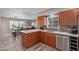 Modern kitchen with stainless steel appliances, quartz countertops, and stylish cabinets at 6810 E Almeria Rd, Scottsdale, AZ 85257
