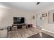 Spacious living room featuring wood-look tile floors and a ceiling fan at 6810 E Almeria Rd, Scottsdale, AZ 85257