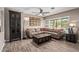 Cozy living room with wood-look tile flooring, a ceiling fan, and comfortable seating at 6810 E Almeria Rd, Scottsdale, AZ 85257