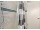 A shower with subway tile and black and white shower curtain at 6810 E Almeria Rd, Scottsdale, AZ 85257