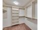 Walk-in closet with custom shelving at 7161 E Rancho Vista Dr # 1013, Scottsdale, AZ 85251