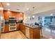 Stylish kitchen with wooden cabinets, stainless appliances, and granite countertops at 7161 E Rancho Vista Dr # 1013, Scottsdale, AZ 85251