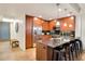 Modern kitchen with stainless steel appliances, sleek countertops, and breakfast bar at 7161 E Rancho Vista Dr # 1013, Scottsdale, AZ 85251