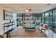 Bright living room with floor to ceiling windows and stylish furniture at 7161 E Rancho Vista Dr # 1013, Scottsdale, AZ 85251