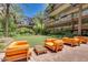 Charming outdoor lounge area with inviting seating area and putting green at 7161 E Rancho Vista Dr # 1013, Scottsdale, AZ 85251