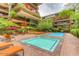 Resort-style pool and spa area surrounded by lush landscaping and lounge chairs at 7161 E Rancho Vista Dr # 1013, Scottsdale, AZ 85251