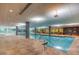 Indoor pool with tile surround and large windows to let the light in at 7161 E Rancho Vista Dr # 1013, Scottsdale, AZ 85251