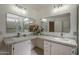 Bathroom with double vanity, granite countertops, and decorative mirrors at 717 E Temple St, Chandler, AZ 85225