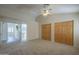 Spacious bedroom with vaulted ceilings, neutral carpet, and wooden closet doors at 717 E Temple St, Chandler, AZ 85225