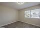 Bedroom featuring wood floors, a window, and neutral paint at 717 E Temple St, Chandler, AZ 85225