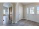 Bright foyer featuring stylish flooring, ample closet space, and convenient access to various parts of the home at 717 E Temple St, Chandler, AZ 85225