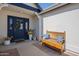 Inviting entryway with a decorative bench and a beautifully adorned front door, creating a warm welcome at 717 E Temple St, Chandler, AZ 85225