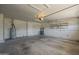 Large two car garage with access door, shelving and water heater at 717 E Temple St, Chandler, AZ 85225