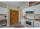 Well-designed kitchen area with built in desk space and plenty of storage space at 717 E Temple St, Chandler, AZ 85225